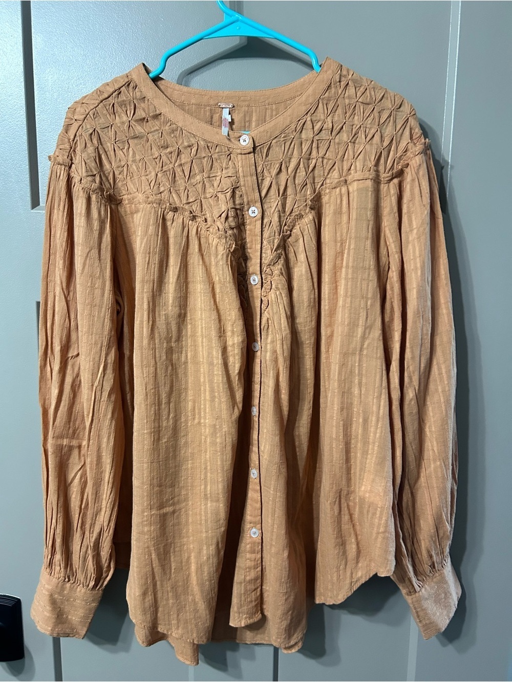 Free People Marigold Button Down Top in a burnt orange color